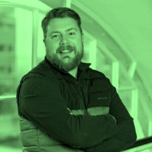 1719496437963-1jpeg - Open Opportunities A green tinted headshot of Mark Hamilton, one of OpenOpps' users.
